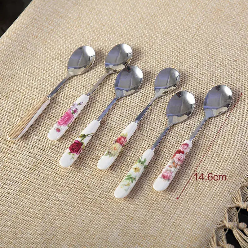 Set of six decorative decorbites™ coffee spoons with floral ceramic handles and stainless steel bowls for elegant tableware