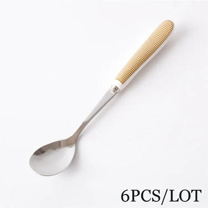 Decorbites™ coffee spoon set featuring a stainless steel spoon with a textured beige woven handle for elegant use