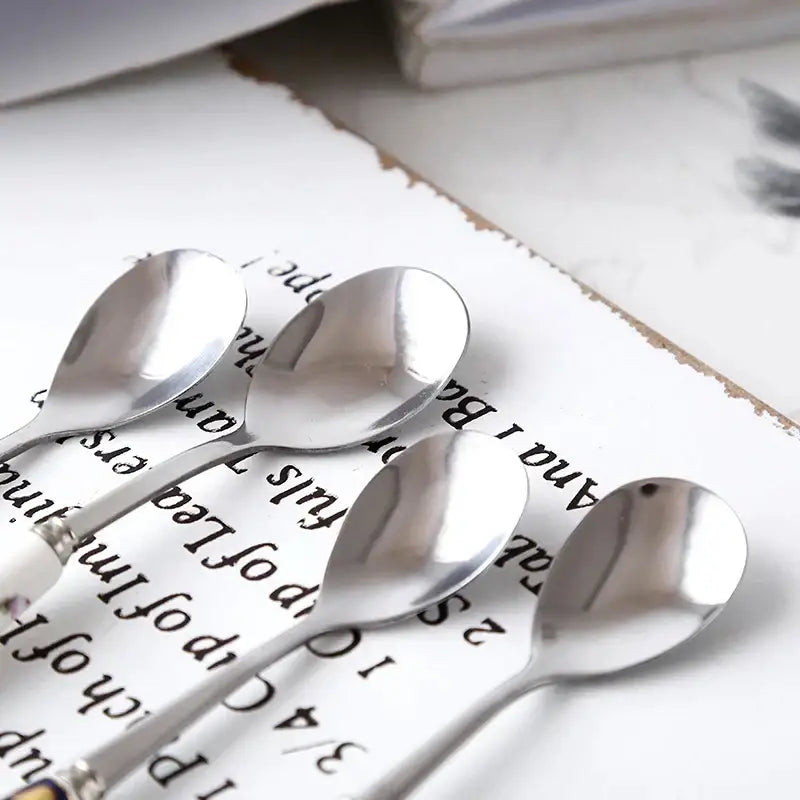 Set of four sleek polished stainless steel coffee spoons with elegant curved handles from decorbites coffee spoon set