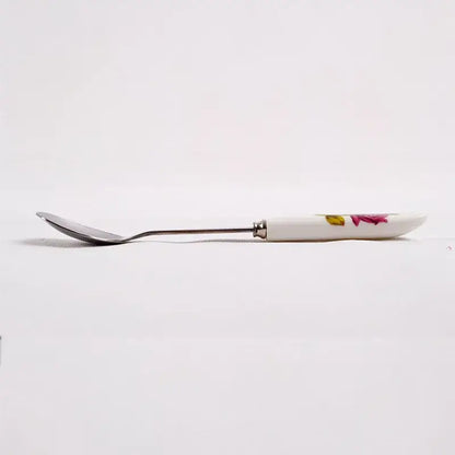 Decorbites™ coffee spoon set featuring a white ceramic spoon with floral design and polished stainless steel handle