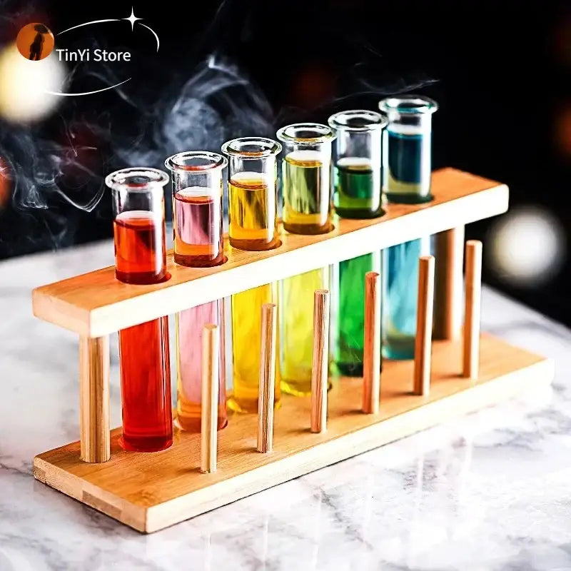 Wooden rack holding clear glass test tube cocktail glasses filled with colorful liquids from decorbites 6-piece set