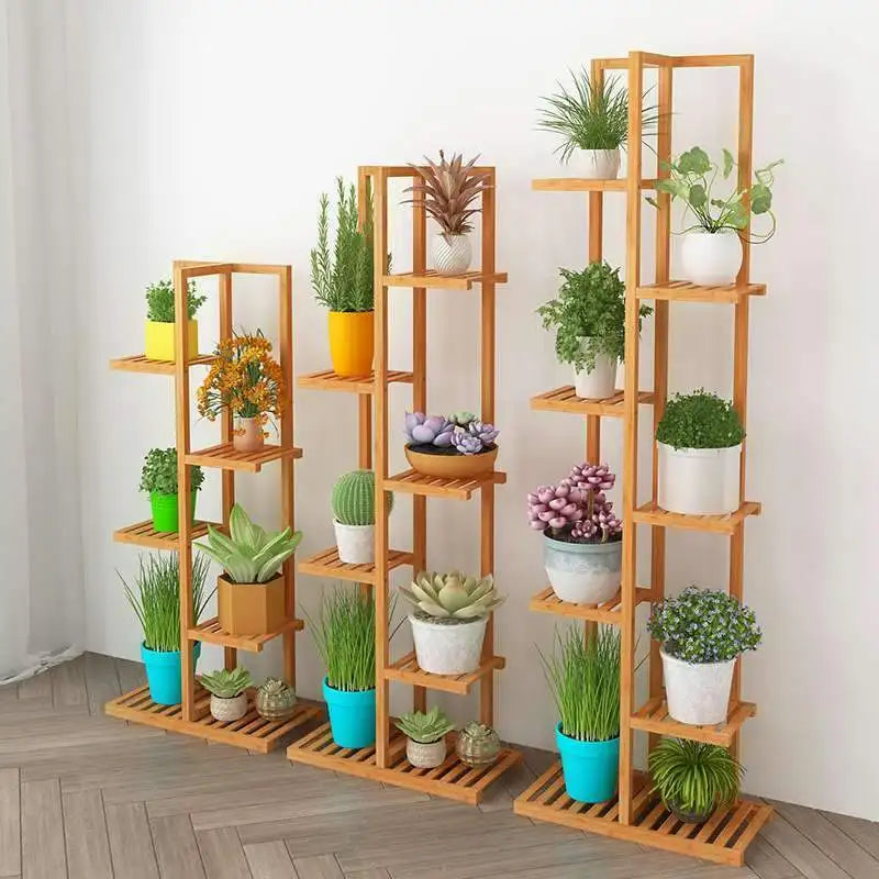 Set of three light brown bamboo plant stands with multiple shelves holding colorful potted plants for indoor outdoor display