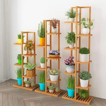 Set of three light brown bamboo plant stands with multiple shelves holding colorful potted plants for indoor outdoor display