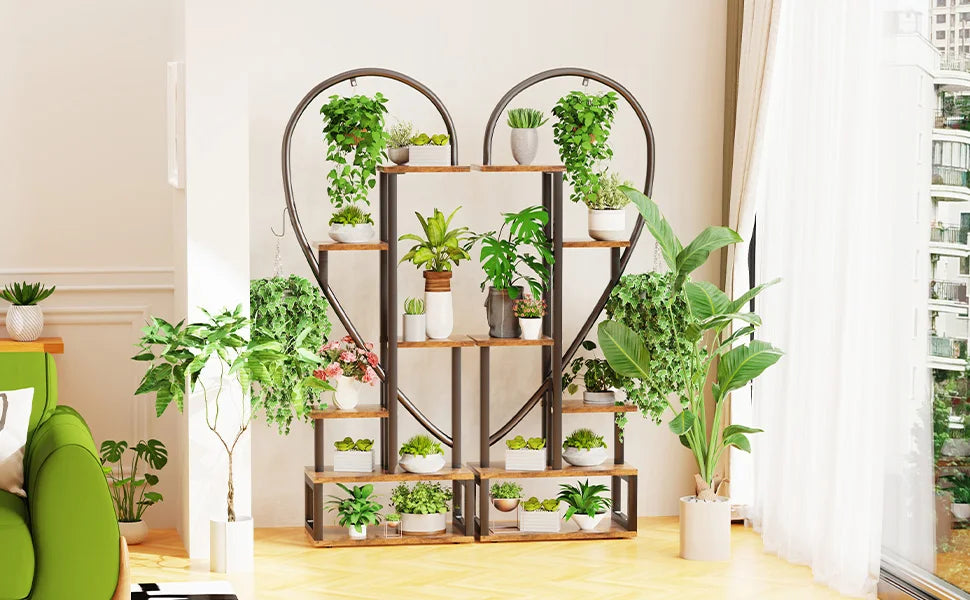 DecorBites™ 6-tier half heart plant stand with dark metal frame and light wood shelves holding green potted plants