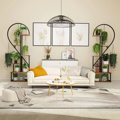 White sofa with mustard yellow pillow and gray cushions beside a DecorBites™ 6-tier heart shaped plant display stand