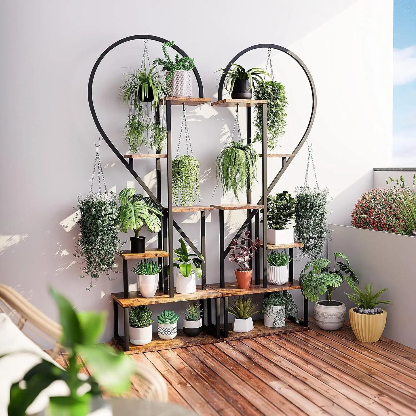 DecorBites 6-tier heart shaped plant display stand with wooden shelves and black metal frame holding potted plants
