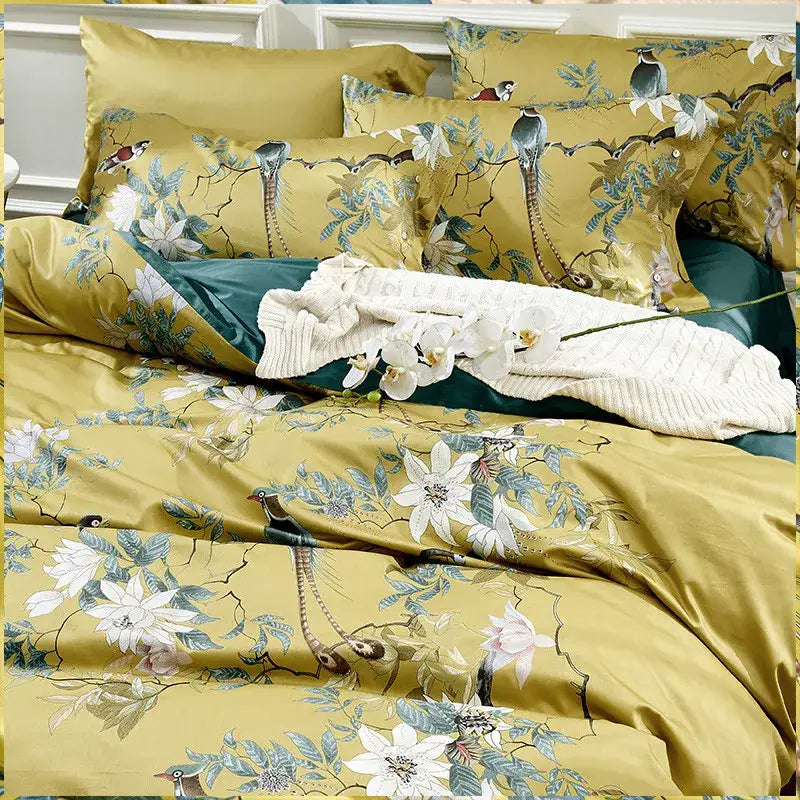Golden satin bedding set with peacock floral patterns in white blue teal made of 600tc Egyptian cotton by DecorBites