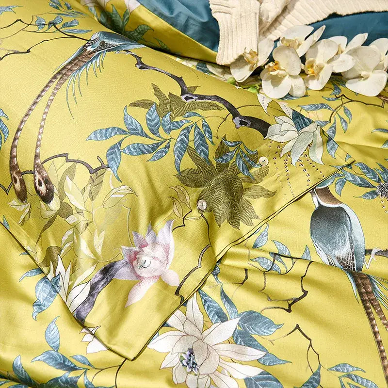 Vibrant yellow satin duvet cover with blue green bird and blossom design in decorbites 600tc egyptian cotton bedding set