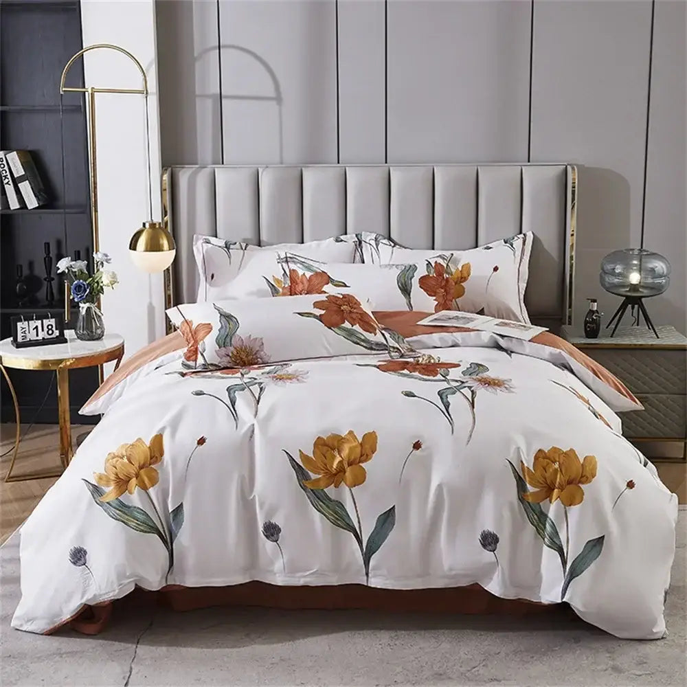 White duvet set with floral pattern of orange yellow flowers green leaves and purple buds in 600tc egyptian cotton bedding set