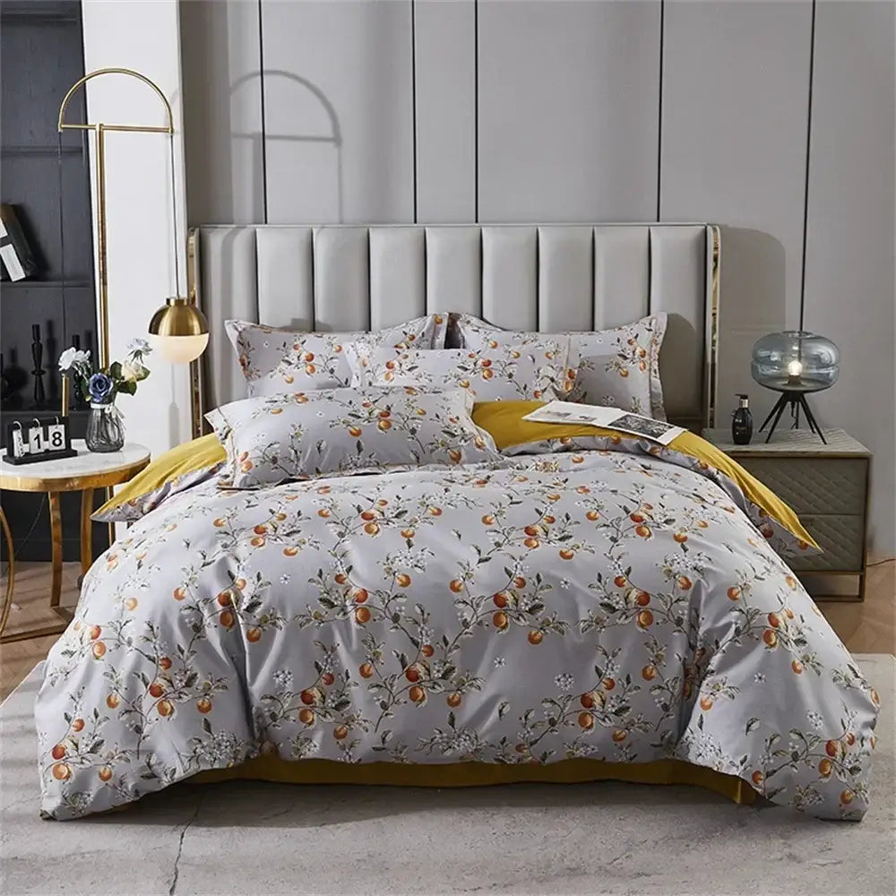 Gray duvet cover with delicate orange fruit floral pattern and gold trim in decorbites 600tc egyptian cotton bedding set