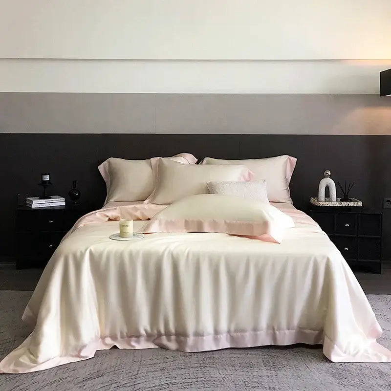 Cream-colored satin bedsheet with subtle pink trim from decorbites 600tc lyocell eucalyptus fiber bedding set