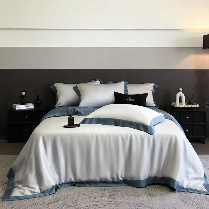 Luxury decorbites™ 600tc lyocell eucalyptus fiber bedding set in soft white with navy blue piping and subtle sheen