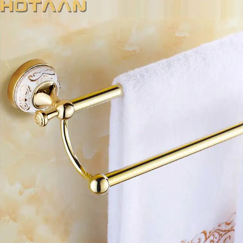 DecorBites™ 60cm double towel bar with gold finish metal bars and ornate white ceramic mounting plate for bathroom use
