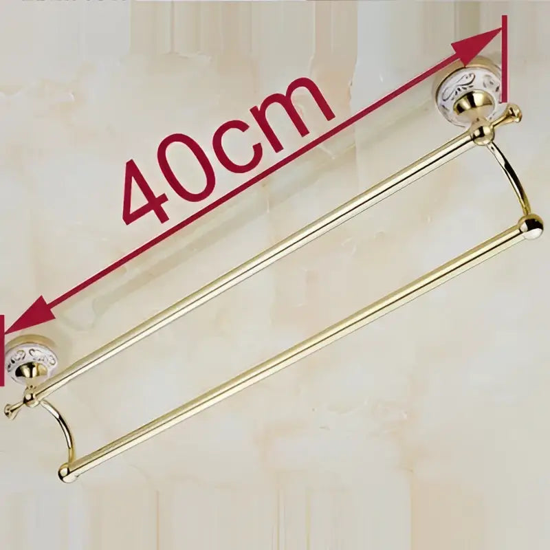 Brass double towel bar with decorative ceramic gold finish end caps for bathroom accessories by decorbites