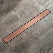 Decorbites 60cm rose gold bathroom floor drain strainer copper color sleek modern design set in gray wood flooring