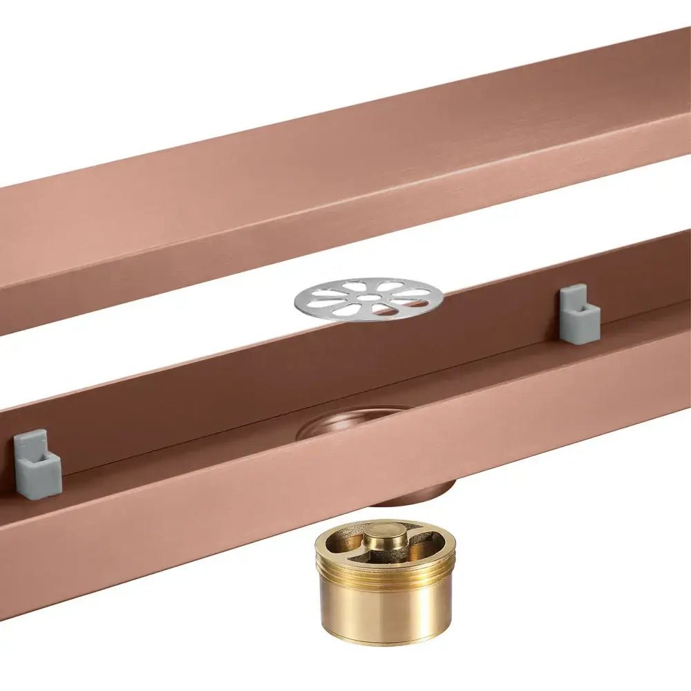 Decorbites 60cm rose gold floor drain with copper-colored metal flower-shaped grate and brass fittings for bathroom use