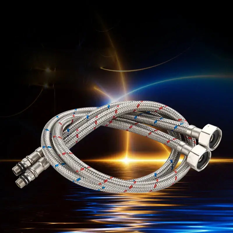 Silver braided stainless steel plumbing pipes with red and blue stripes and metallic connectors for water supply