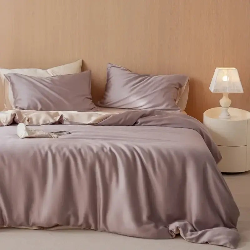 A soft lavender satin duvet cover set with matching pillowcases from the decorbites 60s rayon silk bedding set featuring a smooth glossy finish