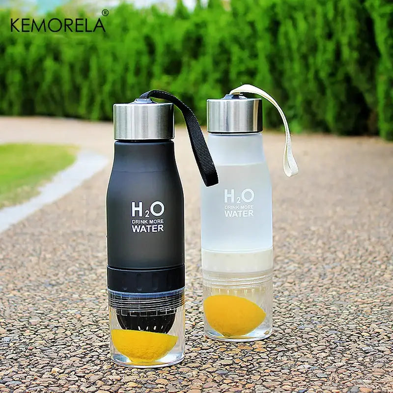 Two Kemorela 650ml infuser water bottles in black and translucent white with silver caps and citrus-infused design