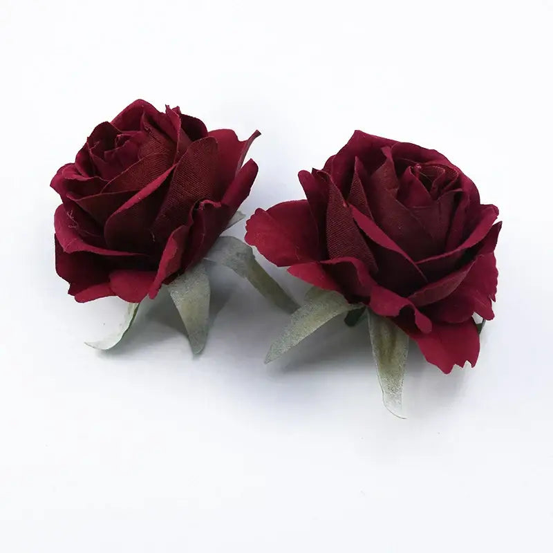 Two deep burgundy fabric 6cm roses head artificial flowers with layered petals and translucent green leaves for home decor
