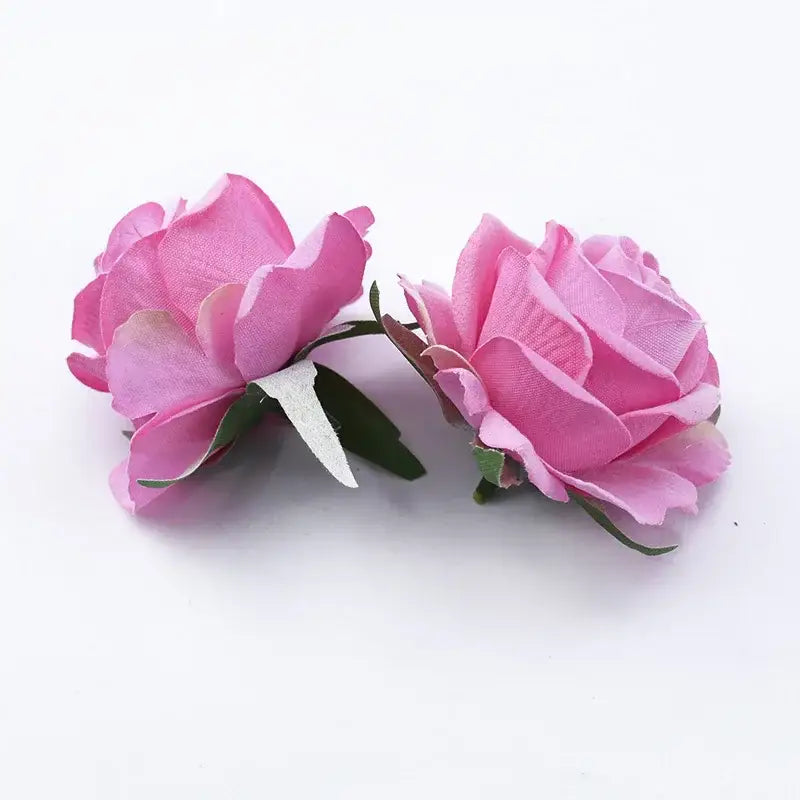 Two artificial pink 6cm roses head with fabric petals and green stems one with a white plastic clip for home decor
