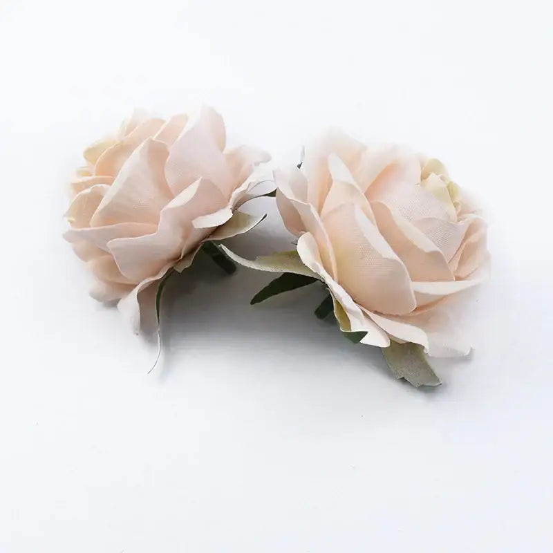 Two delicate blush pink artificial flowers with soft layered petals and green leaves decorbites™ 6cm roses head
