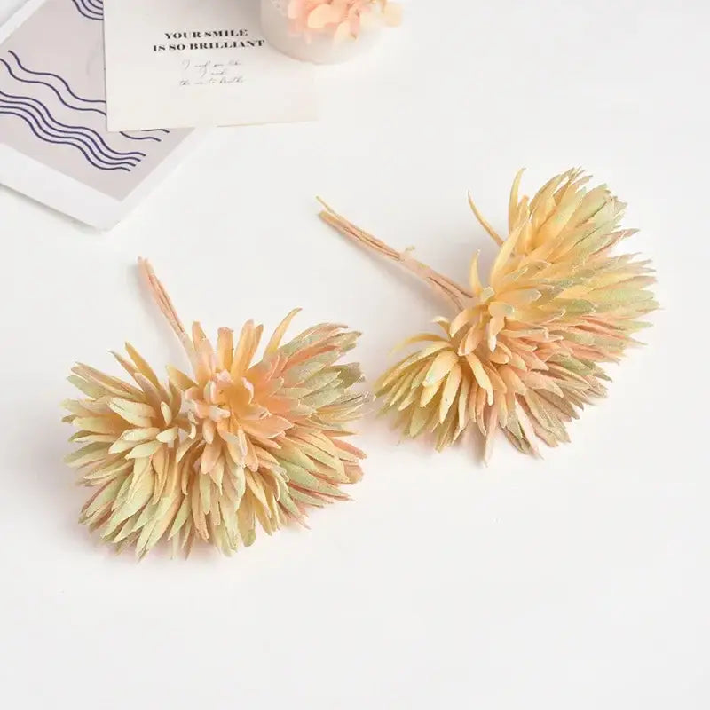 Two silk mini handmade peach and green gradient pom-pom flowers with layered textured petals for home decoration