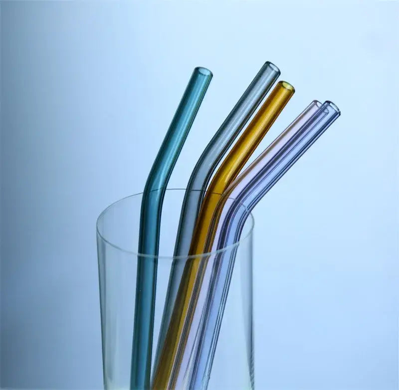 A set of DecorBites™ 6 colorful curved juice straws in teal silver gold and lavender heat-resistant glass