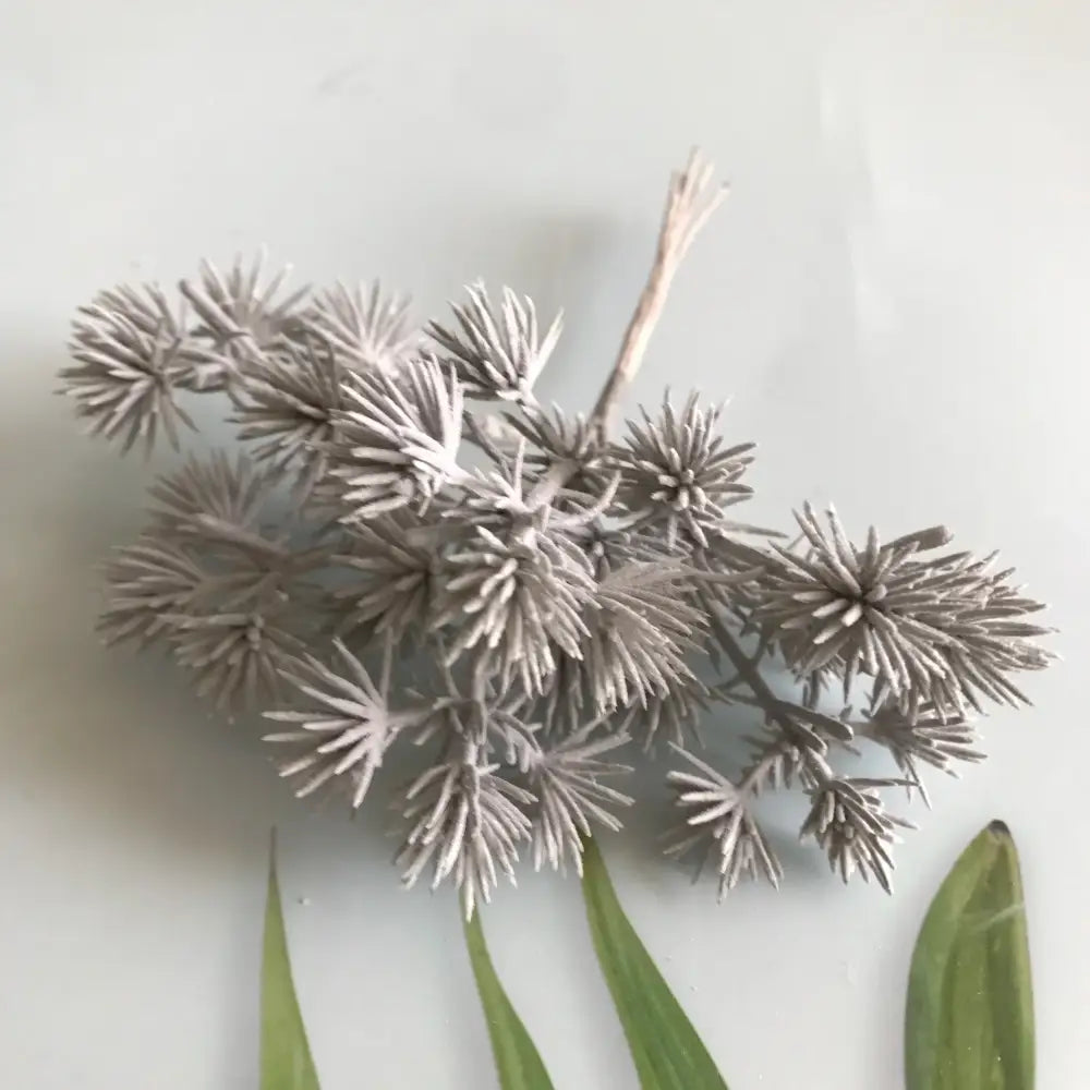 A cluster of artificial silver-colored spiky dried flowers with a frost-like finish from decorbites 6pcs dried flower mix