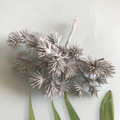 A cluster of artificial silver-colored spiky dried flowers with a frost-like finish from decorbites 6pcs dried flower mix