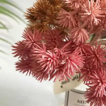 A cluster of artificial pink and copper spiky dried flowers with textured fabric finish in a 6pcs dried flower mix