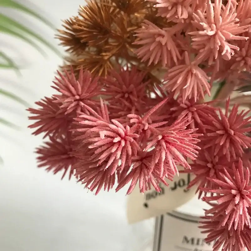 A cluster of artificial pink and copper spiky dried flowers with textured fabric finish in a 6pcs dried flower mix