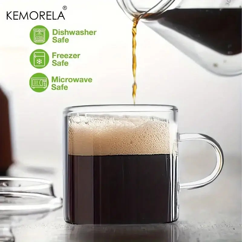 Clear glass mug with sturdy handle filled with dark coffee topped with frothy foam in 6pcs glass espresso cups set