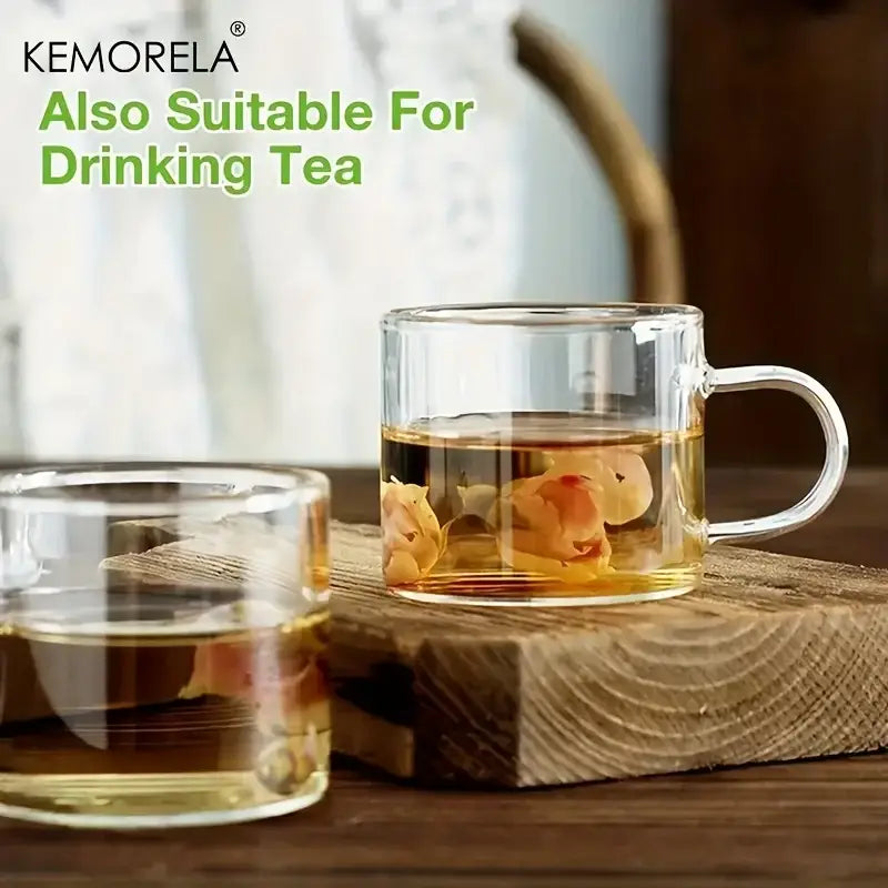 Decorbites™ 6pcs glass espresso cups feature clear glass with handles filled with golden tea and floating dried petals