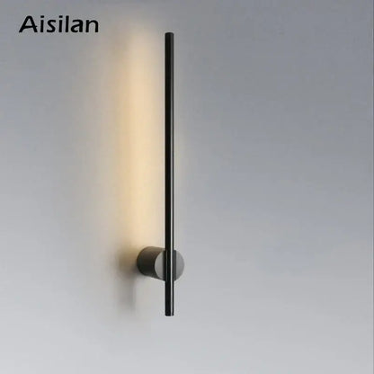 Aisilan minimalist black led wall lamp with sleek cylindrical design emitting warm light for living room and bedside use