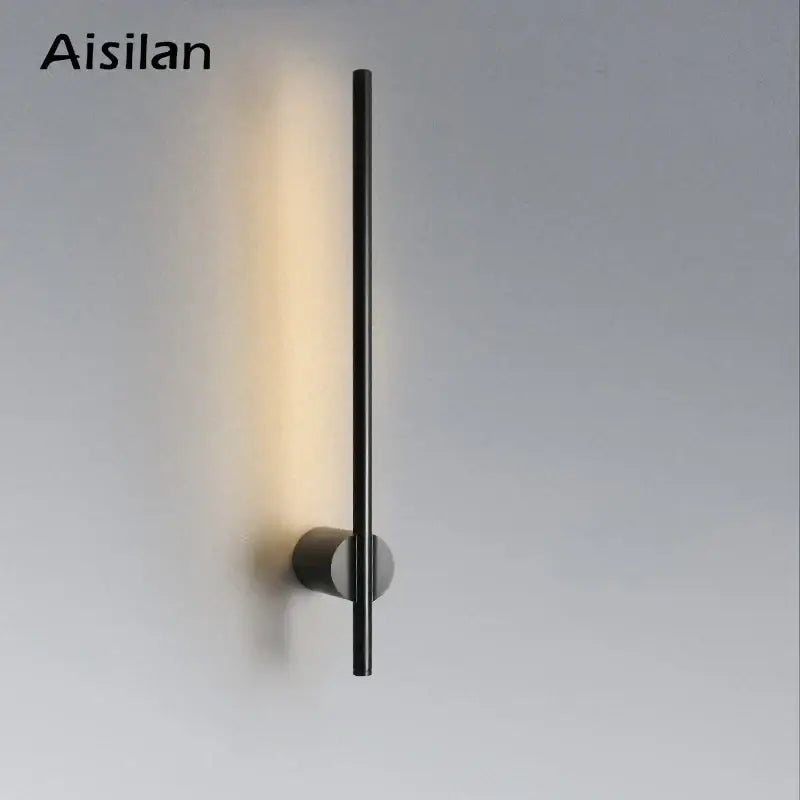 Aisilan minimalist black led wall lamp with sleek cylindrical design emitting warm light for living room and bedside use