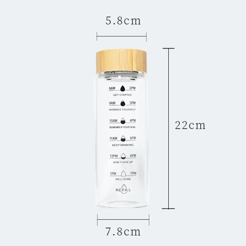 Decorbites 700ml glass water bottle with bamboo lid and measurement markings for hydration tracking and tea filtering