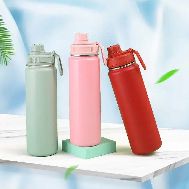 Three pastel green pink and red decorbites™ 750ml stainless steel insulated sports water bottles with carrying loops