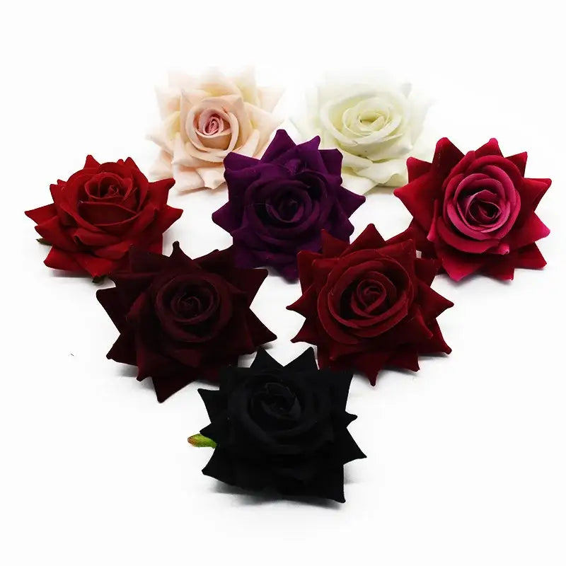 A collection of decorbites 7cm rose heads in red burgundy black white and purple for wedding decor and crafts