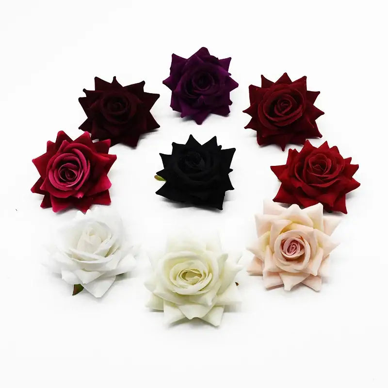 A collection of decorbites 7cm rose heads in deep red burgundy black white and blush pink for wedding décor and crafts