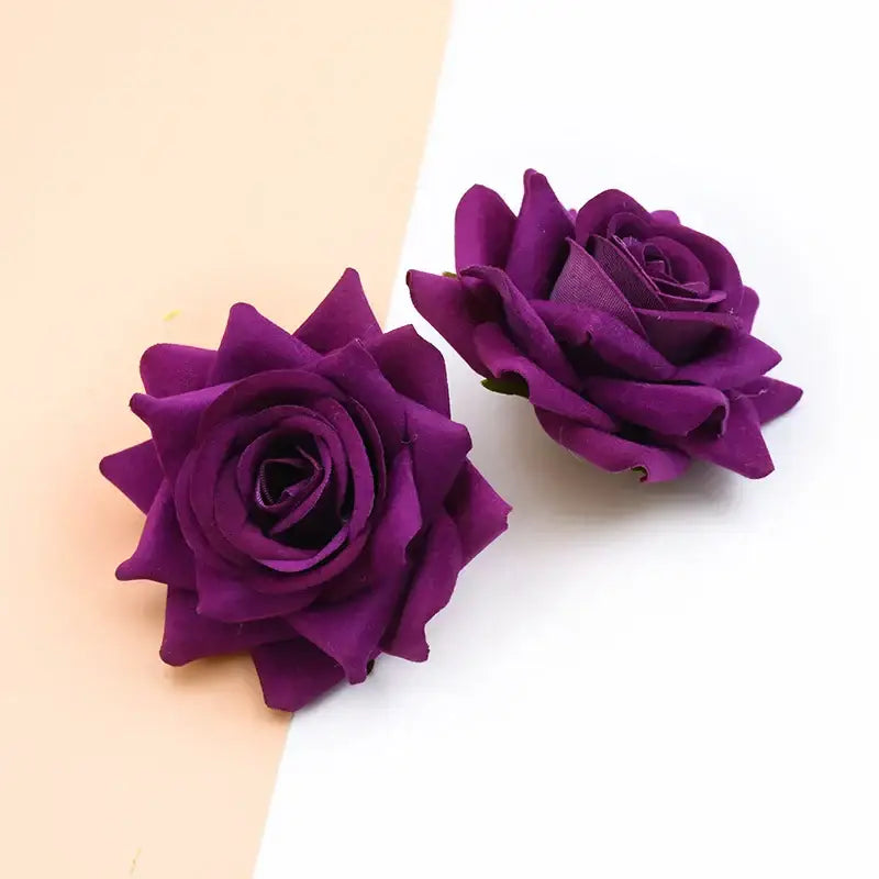 Two deep purple decorbites 7cm rose heads with layered velvety fabric petals for wedding décor and scrapbooking