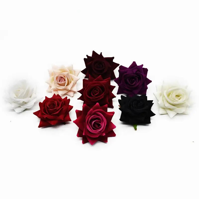 A collection of decorbites 7cm rose heads in white cream deep red burgundy and black for wedding décor and crafts