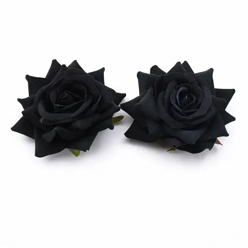 Two artificial black rose heads with detailed petal layers and green stems from decorbites 7cm rose for wedding décor