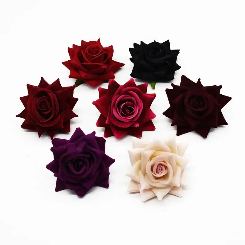 A collection of decorbites 7cm rose heads in burgundy black purple and cream for wedding decor and autumn decoration