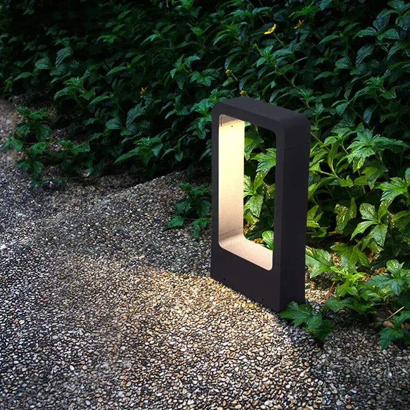 Black rectangular bollard light with glowing warm interior decorbites 7w led aluminum garden for outdoor use