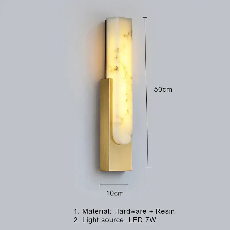 A sleek 50cm tall decorbites 7w led marble wall lamp with brushed gold base and translucent veined resin panel