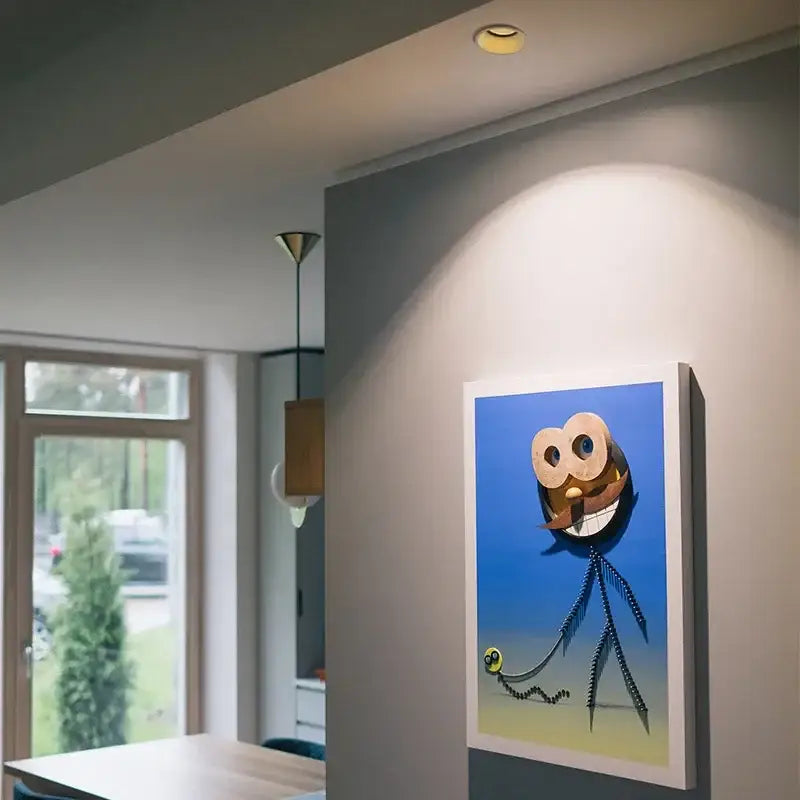 Whimsical cartoon owl artwork with oversized eyes in white frame beside decorbites 7w led recessed downlight dimmable spot light