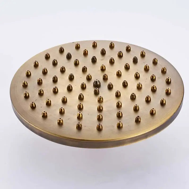 Round brass rainfall shower faucet head with multiple nozzles in antique brass finish for refreshing showers