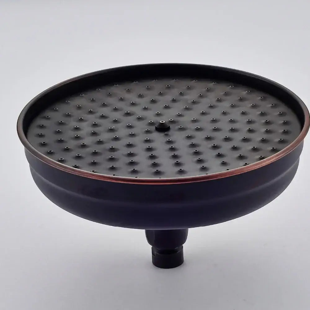Decorbites™ 8 inch brass shower head with black matte finish, copper-toned rim, and evenly spaced spray holes for rainfall use