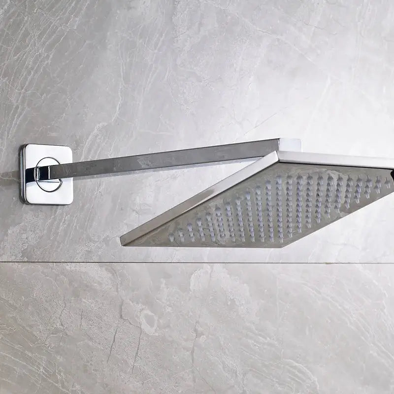 Chrome finished brass square LED rainfall shower head with multiple nozzles in sleek modern design for wall mount use